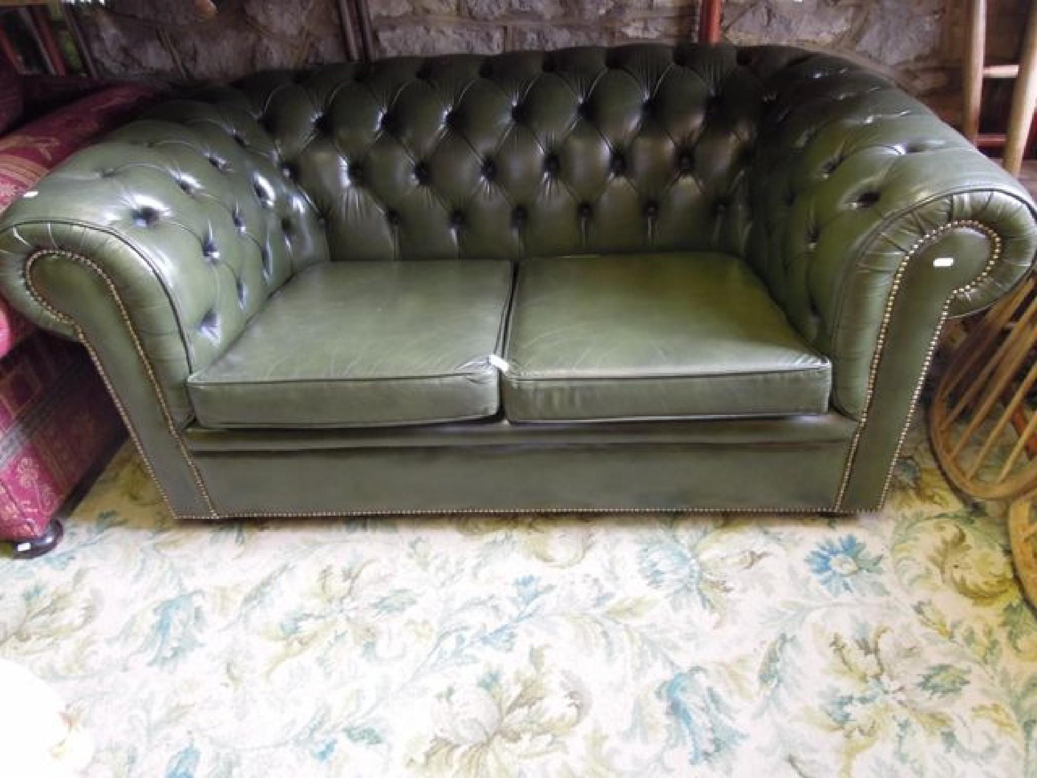 Appraisal: A Victorian style two seat button back Chesterfield sofa with