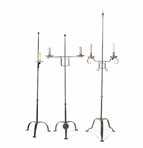 Appraisal: Three wrought iron th c style electric floor lamps