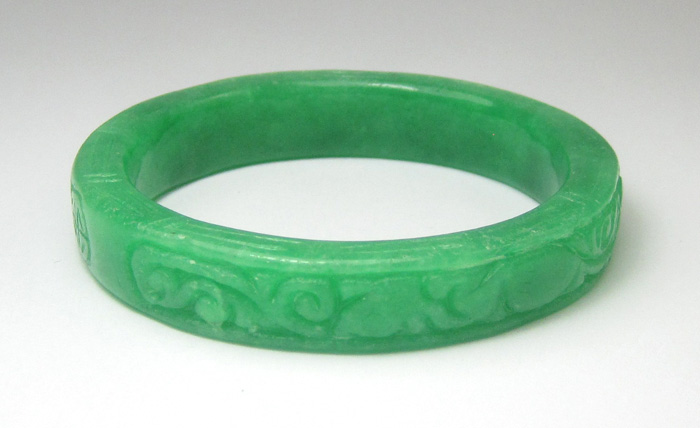 Appraisal: CHINESE CARVED GREEN JADE BANGLE weighing grams and measuring -