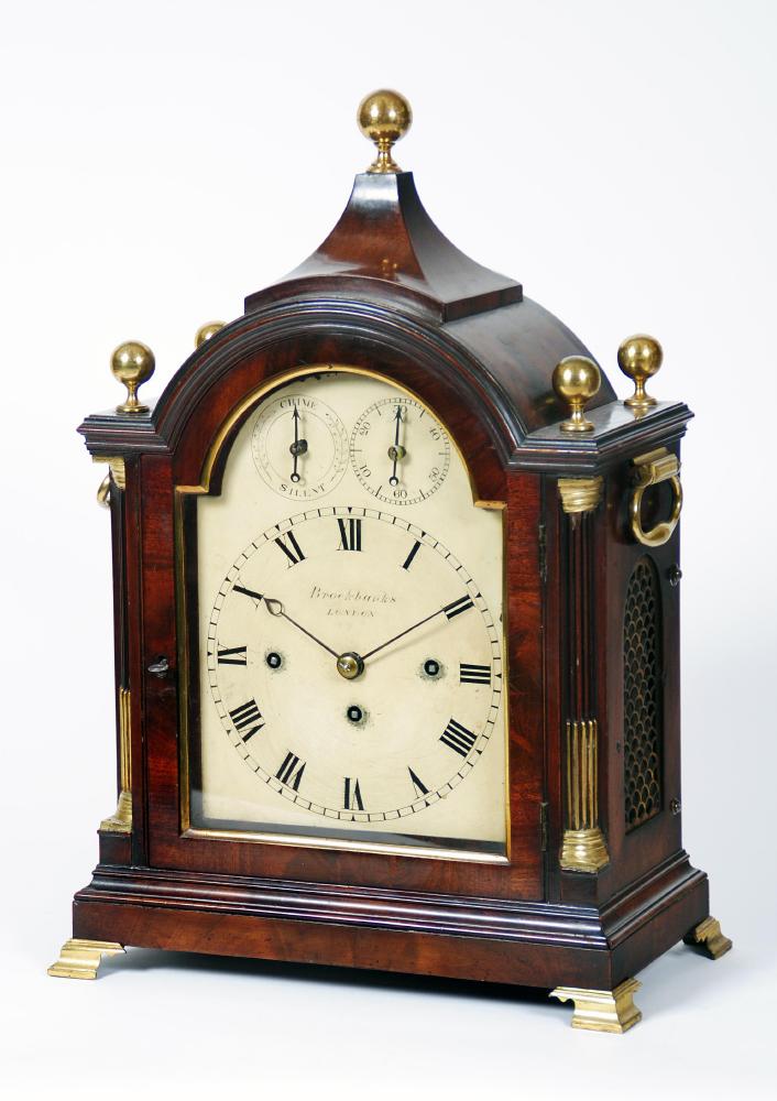 Appraisal: A MAHOGANY CASED TABLE CLOCK by Brocklands London the twin