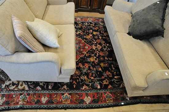 Appraisal: A RUG IN BLUE RED AND CREAM TONES