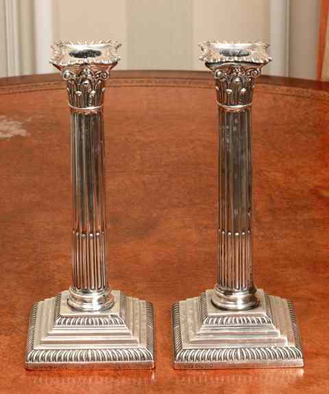 Appraisal: A PAIR OF VICTORIAN CORINTHIAN COLUMN STICK CANDLESTICKS on square