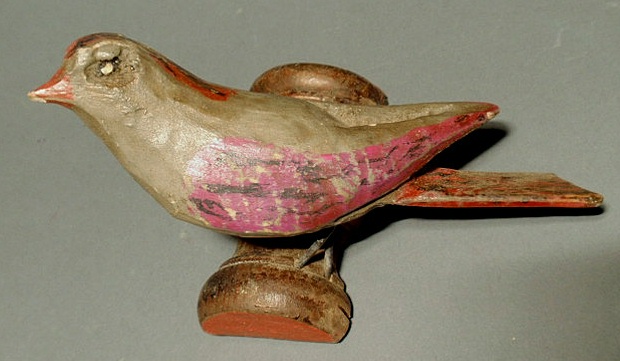 Appraisal: Carved folk art bird with polychrome decoration l