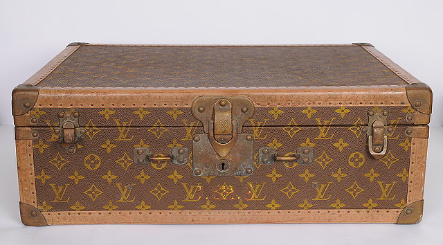 Appraisal: An early th Century Louis Vuitton leather bound suitcase covered