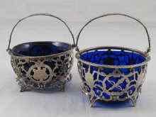 Appraisal: A finely pierced and chased silver sugar basket with blue