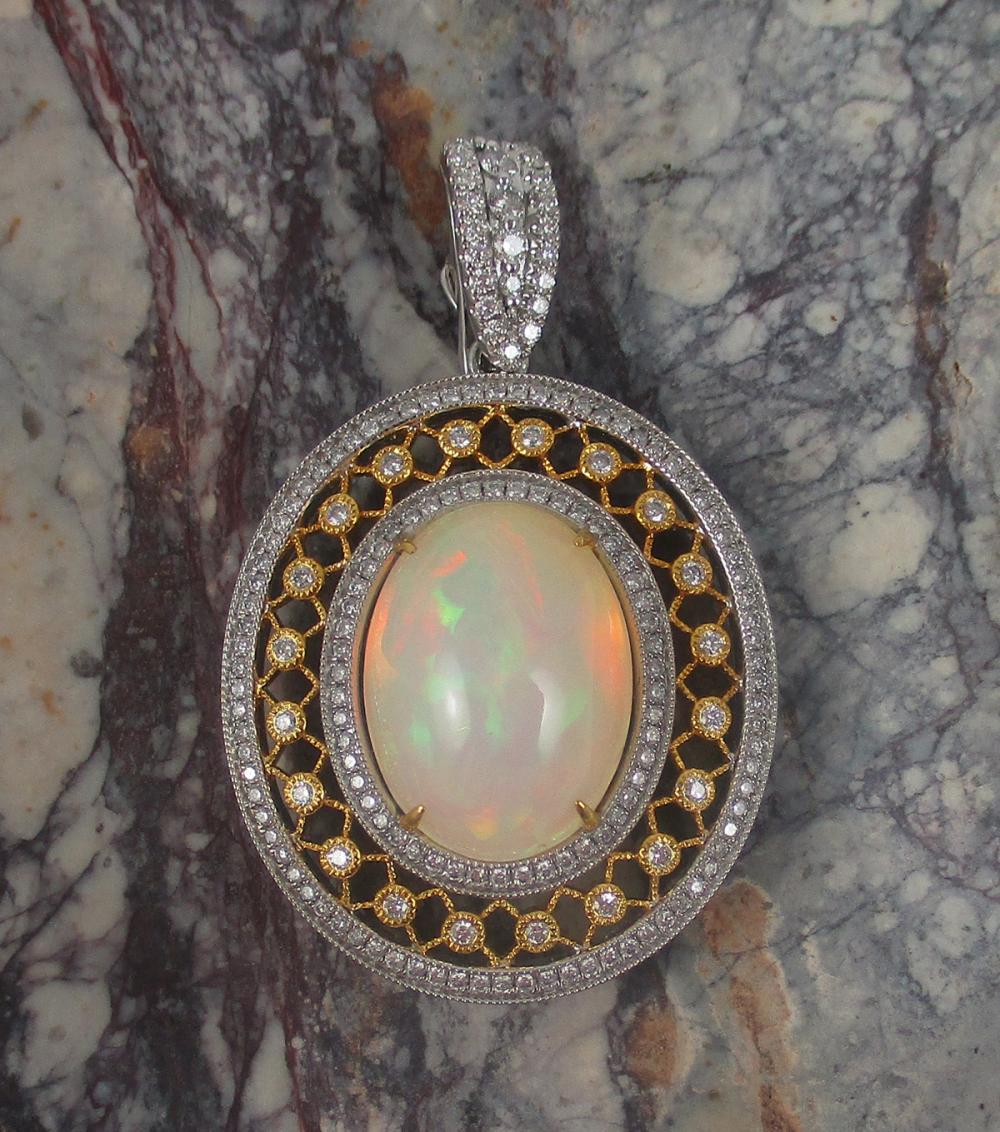 Appraisal: ETHIOPIAN OPAL DIAMOND AND FOURTEEN KARAT GOLD PENDANT The large