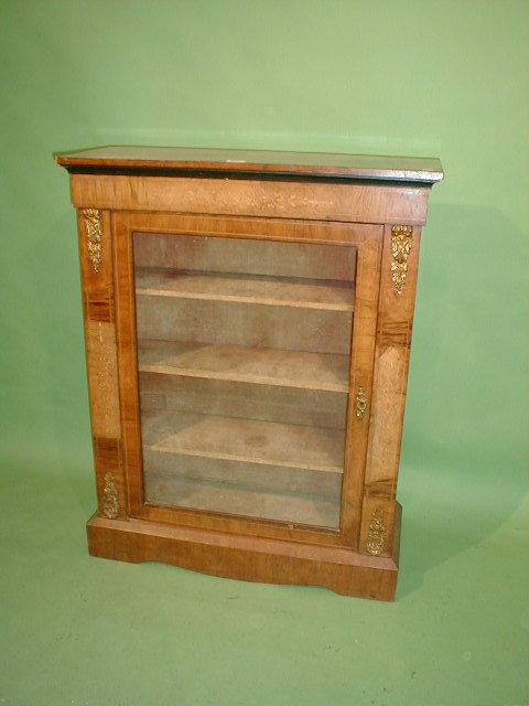 Appraisal: A Victorian walnut pier cabinet with marquetry frieze and uprights