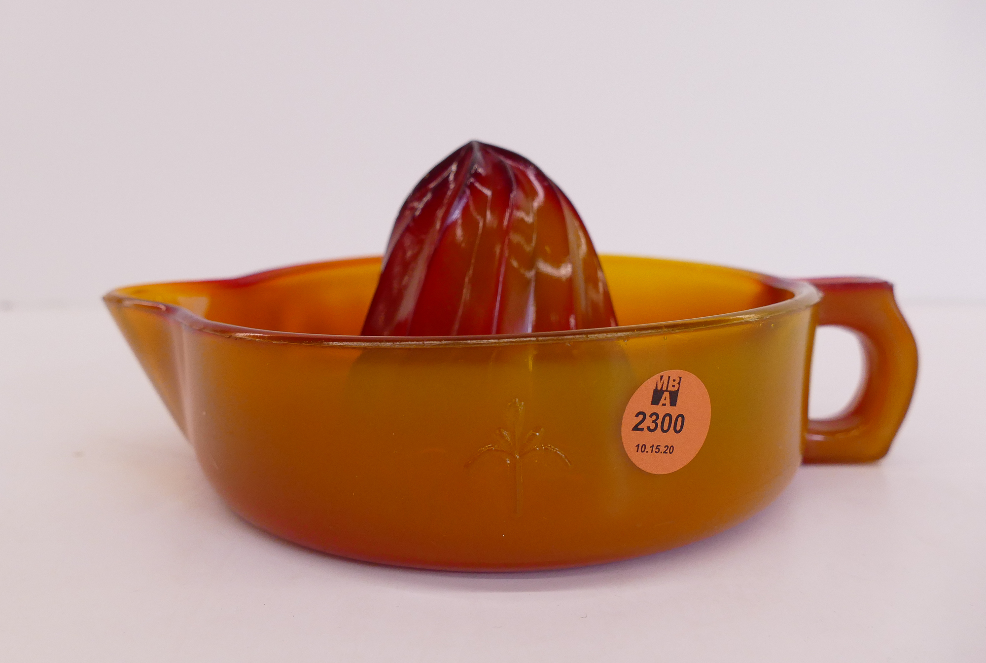 Appraisal: Orange Slag Glass Fluer de Lis Citrus Reamer