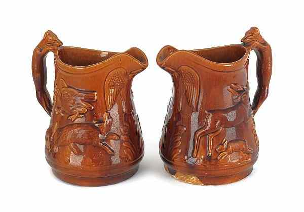 Appraisal: Two large ceramic pitchers with a Rockingham glaze late th