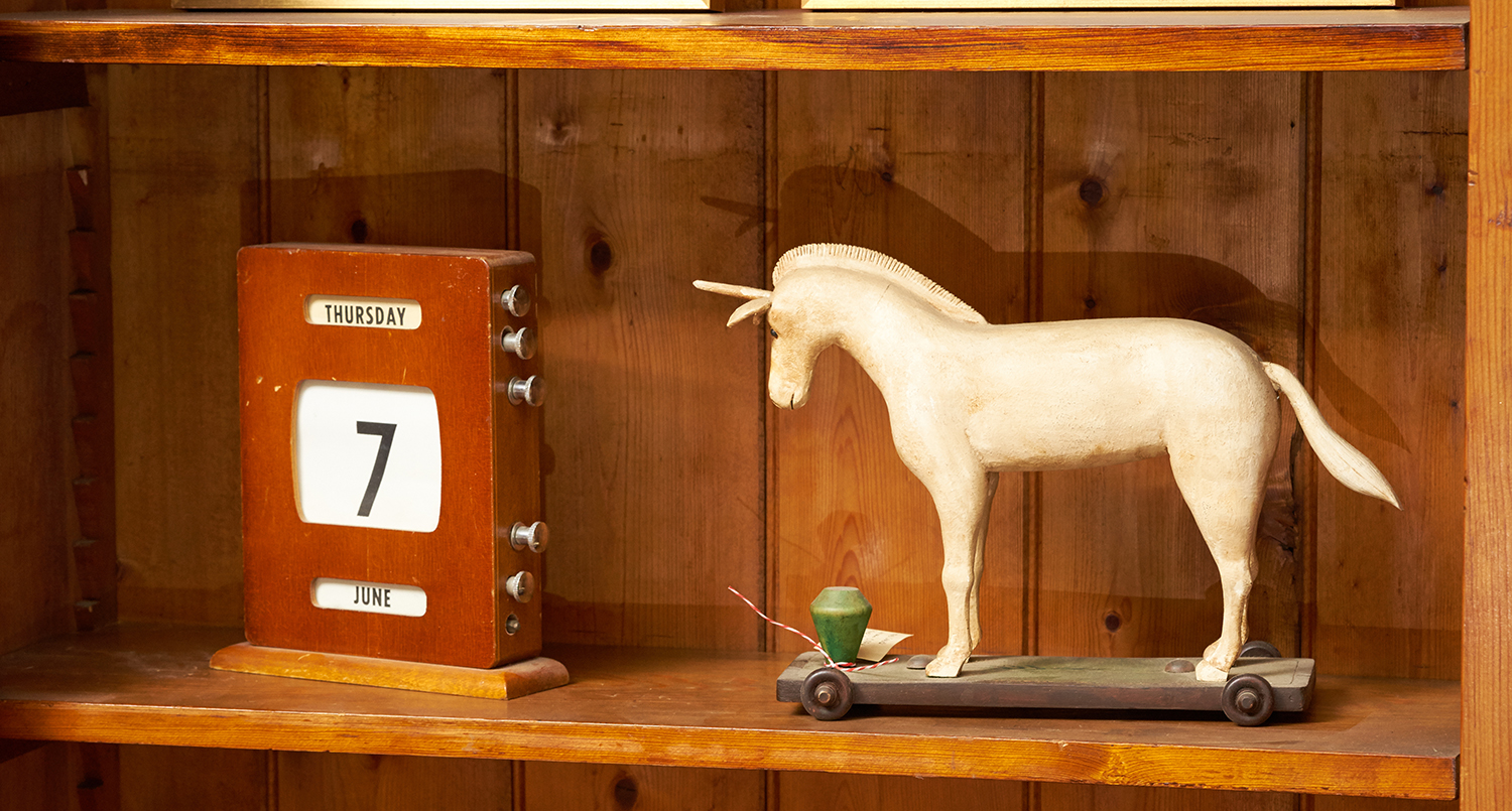 Appraisal: A HAND CARVED UNICORN AND VINTAGE CALENDAR Unicorn signed 'Reineri'