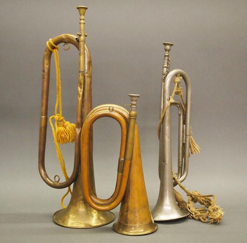 Appraisal: antique bugles Three antique brass bugles Including copper and brass