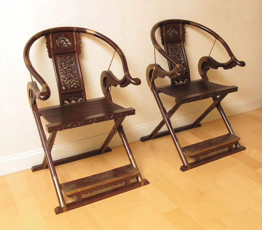 Appraisal: PAIR OF CARVED HORSESHOE BACK FOLDING CHAIRS Approx '' h