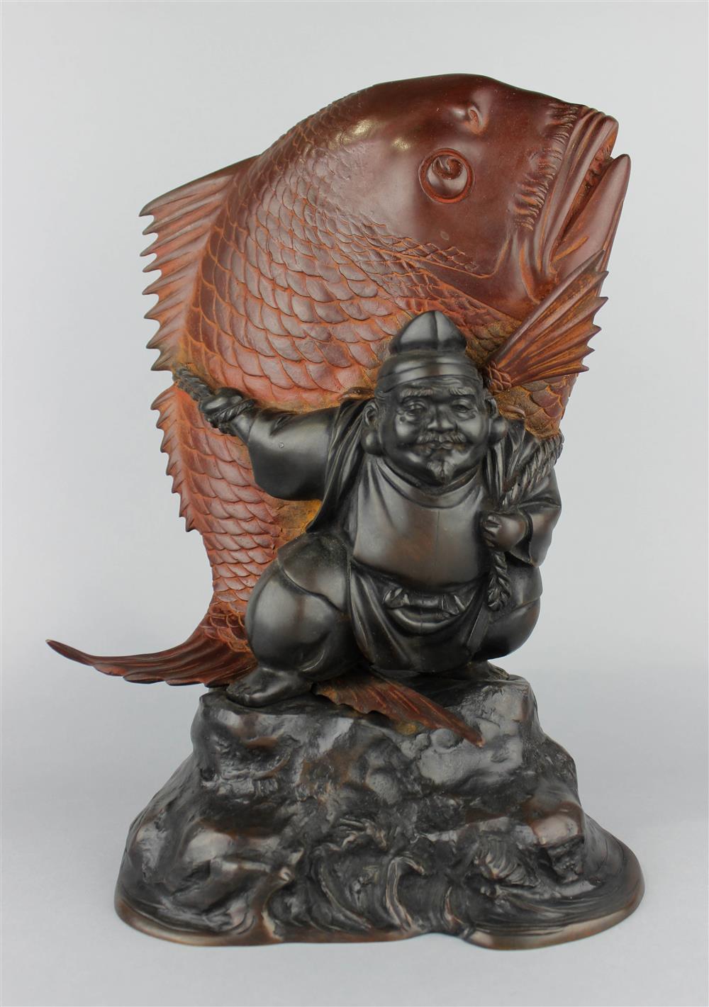 Appraisal: JAPANESE PATINATED BRONZE OF EBISU AND CARP MEIJI PERIOD modeled