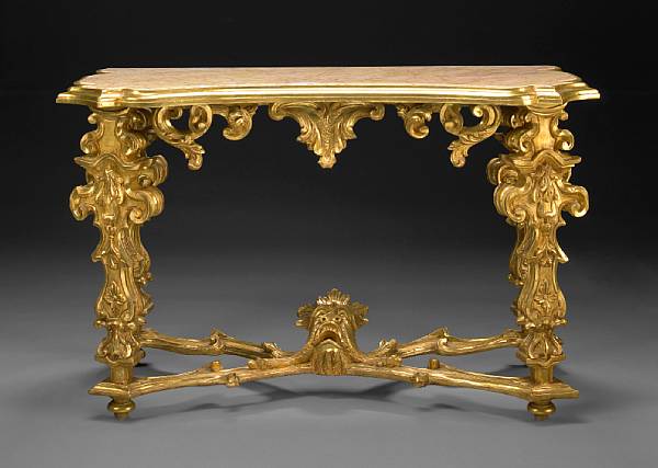 Appraisal: An Italian Rococo style giltwood and marble topped console table