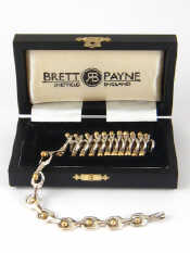 Appraisal: A fine silver and carat gold concertina necklace by Brett