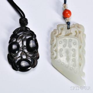 Appraisal: Two Pendants China one nephrite jade carved in the shape