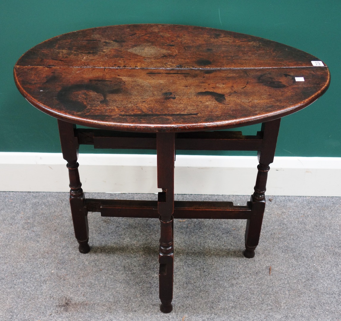 Appraisal: A th century oak coaching table with oval top and