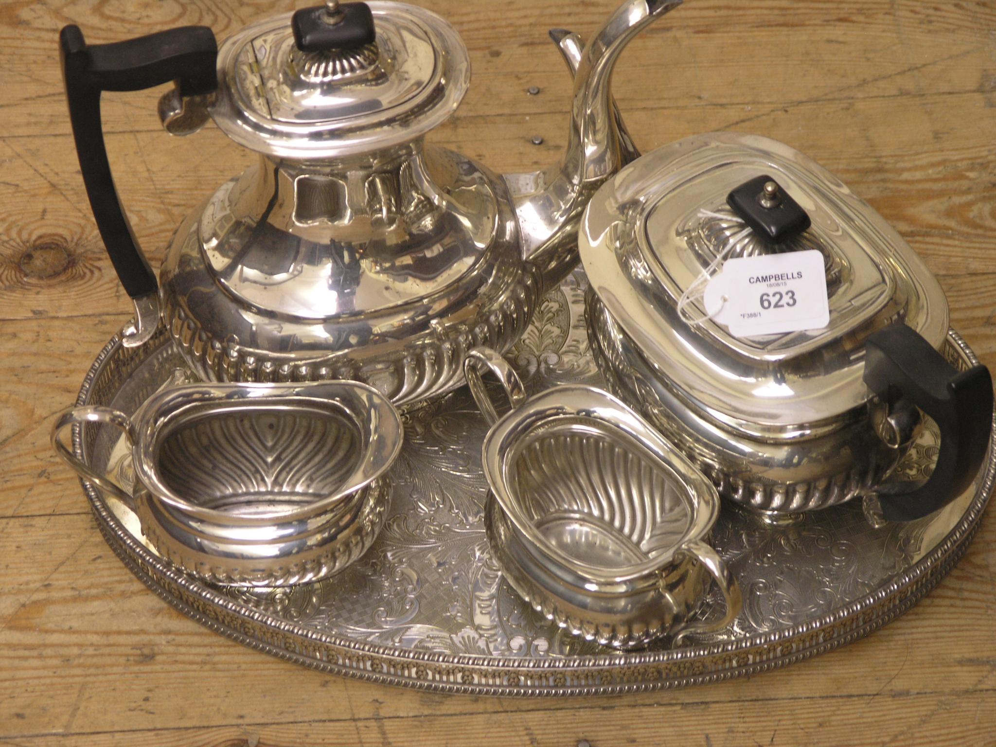 Appraisal: A silver plated four-piece teaset oval half-fluted form on plated