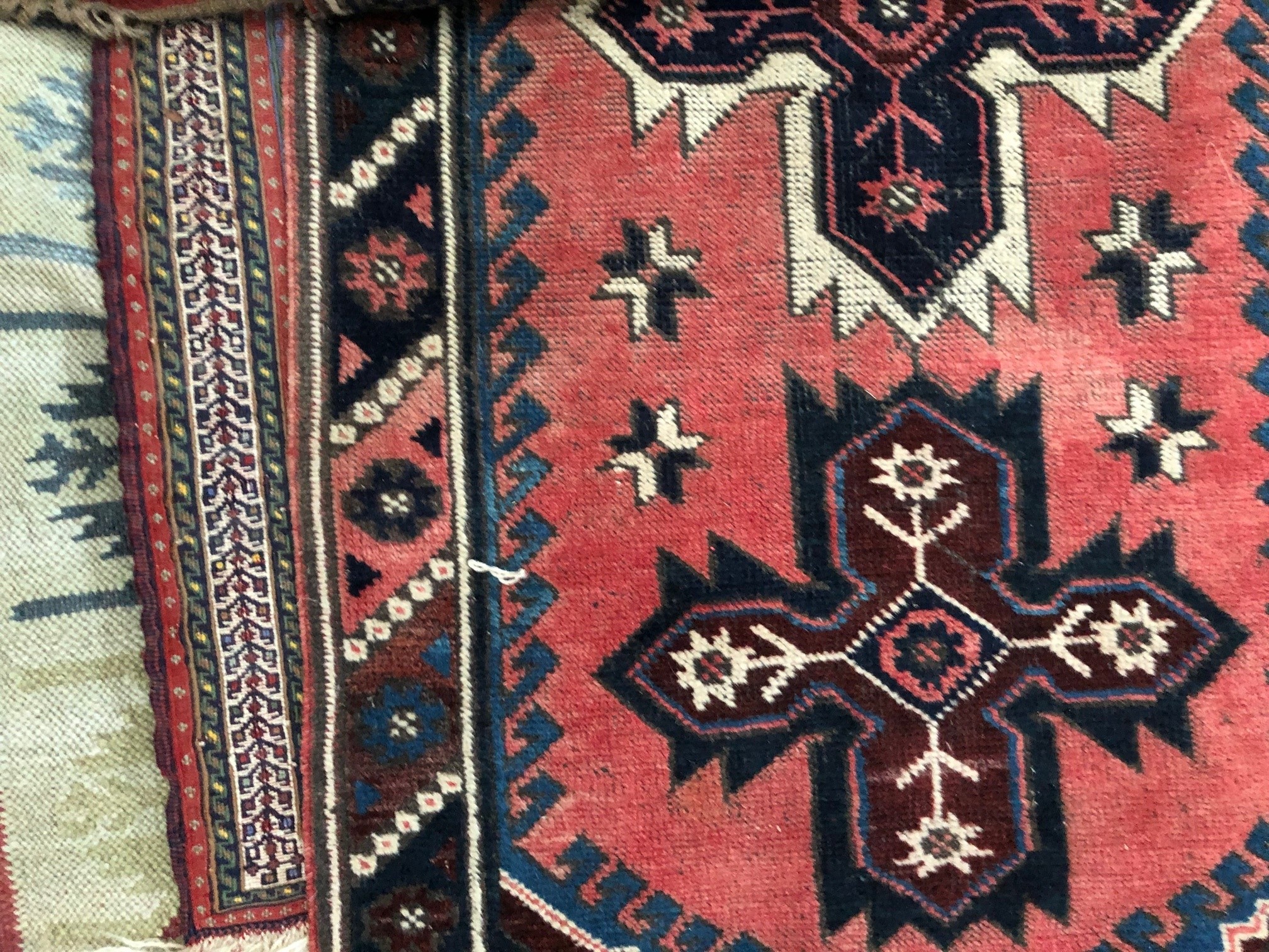 Appraisal: A red ground tribal runner with six cross designs to