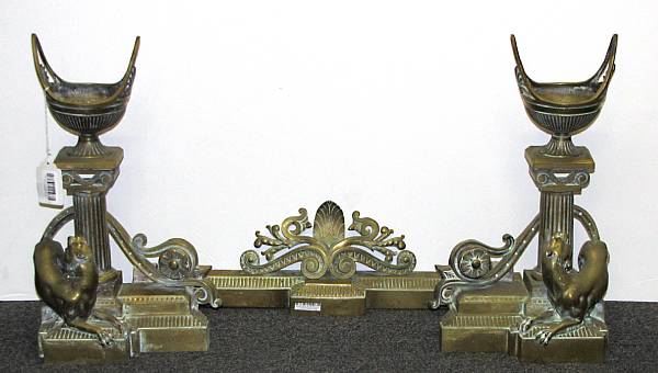 Appraisal: A Napoleon III bronze three piece fire front feu galerie