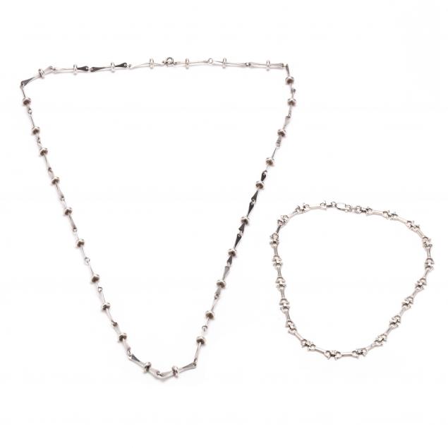 Appraisal: Two Modernist Silver Necklaces To include a necklace in a