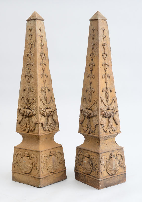 Appraisal: PAIR OF NEOCLASSICAL STYLE CAST-STONE GARDEN OBELISKS Each with flared