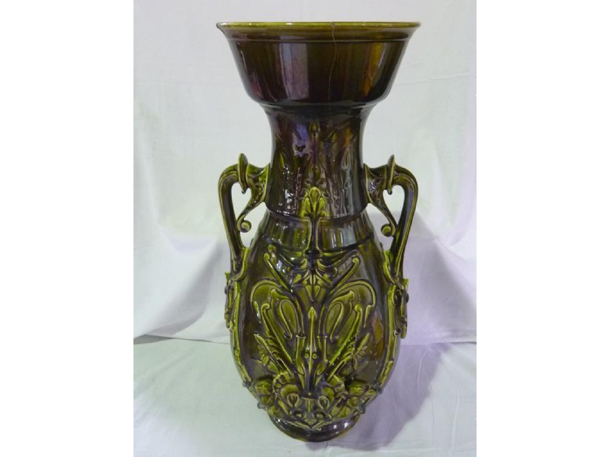 Appraisal: A majolica green two handled vase by Sarreguemines with relief