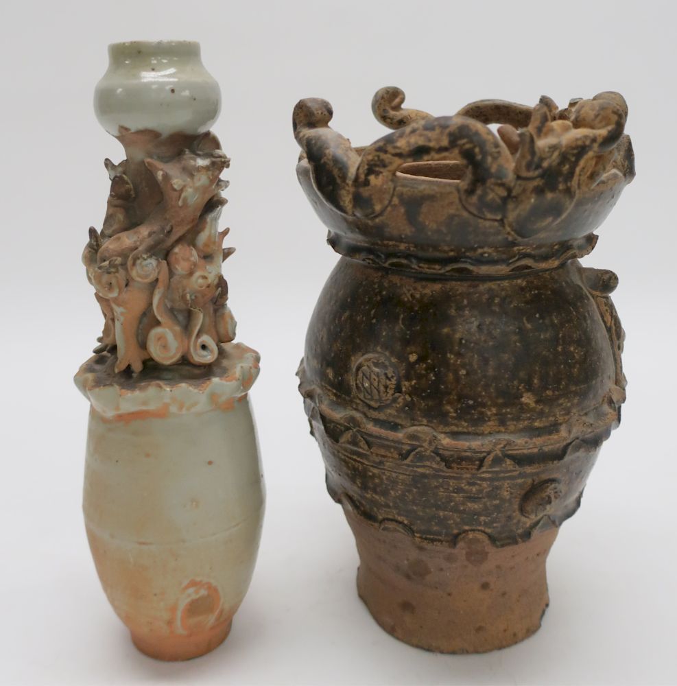 Appraisal: Chinese Pottery Vases With dragons in relief around the rim