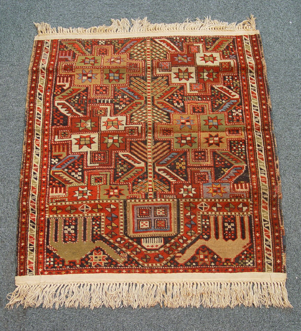 Appraisal: Rectangular prayer mat stitched in colours with camels and geometric