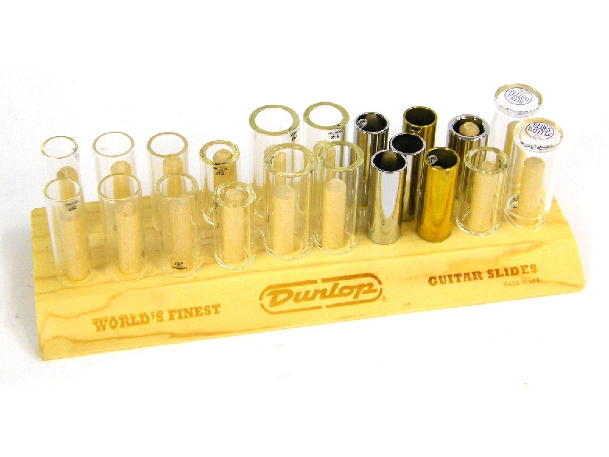 Appraisal: Quantity of Dunlop guitar slides upon a wooden display rack