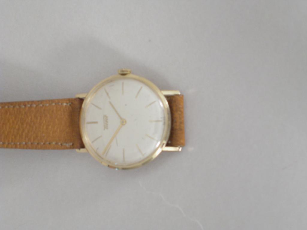 Appraisal: A Gent's Tissot Wristwatch with circular dial in k gold