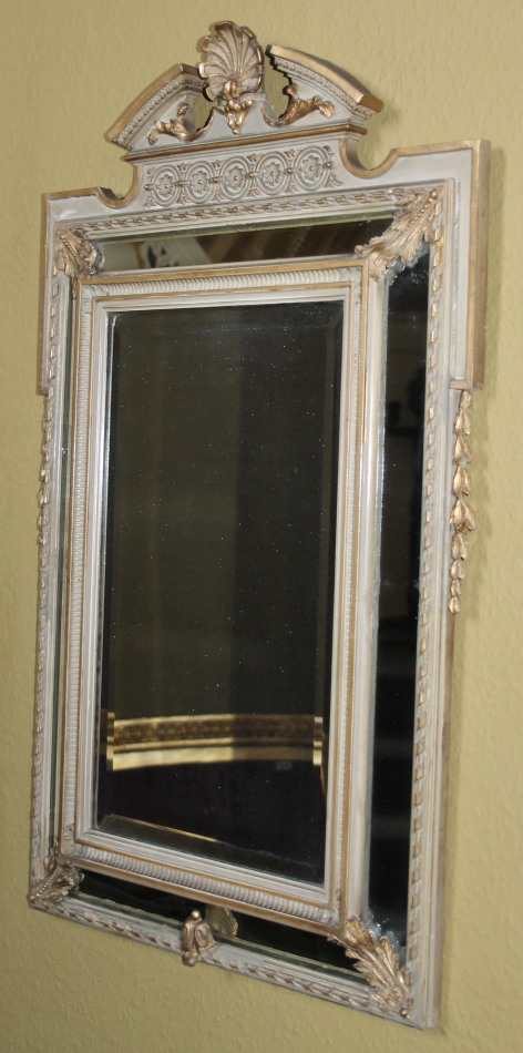 Appraisal: A Continental gilt gesso and painted wall mirror the top