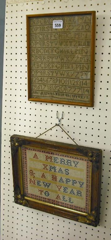 Appraisal: Small framed sampler stitched with the alphabet and numbers x