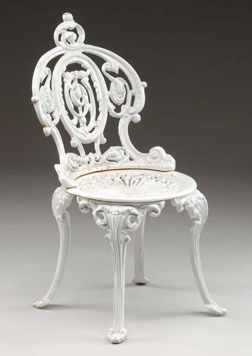 Appraisal: CAST IRON GARDEN CHAIR Curved back with pierce decoration on