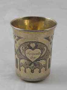 Appraisal: A Russian silver gilt beaker with engraved pan Slavic decoration