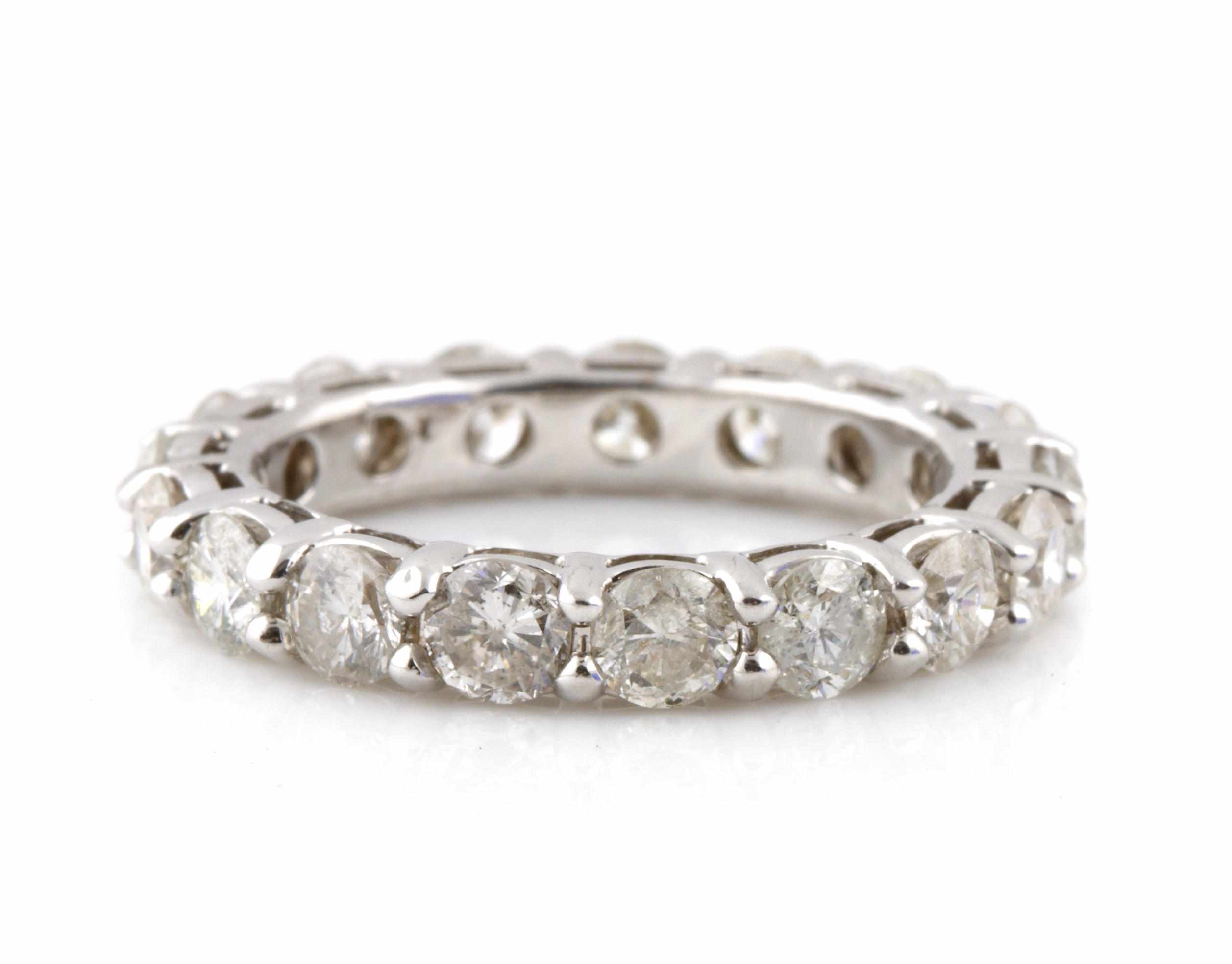 Appraisal: A diamond and white gold eternity band estimated total diamond