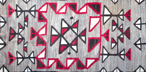 Appraisal: INDIAN Drugget rug in wool with geometric forms in red