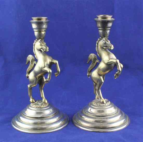 Appraisal: A pair of modern parcel gilt silver candlesticks with rearing