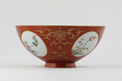 Appraisal: A Chinese coral ground bowl decorated with four famille rose