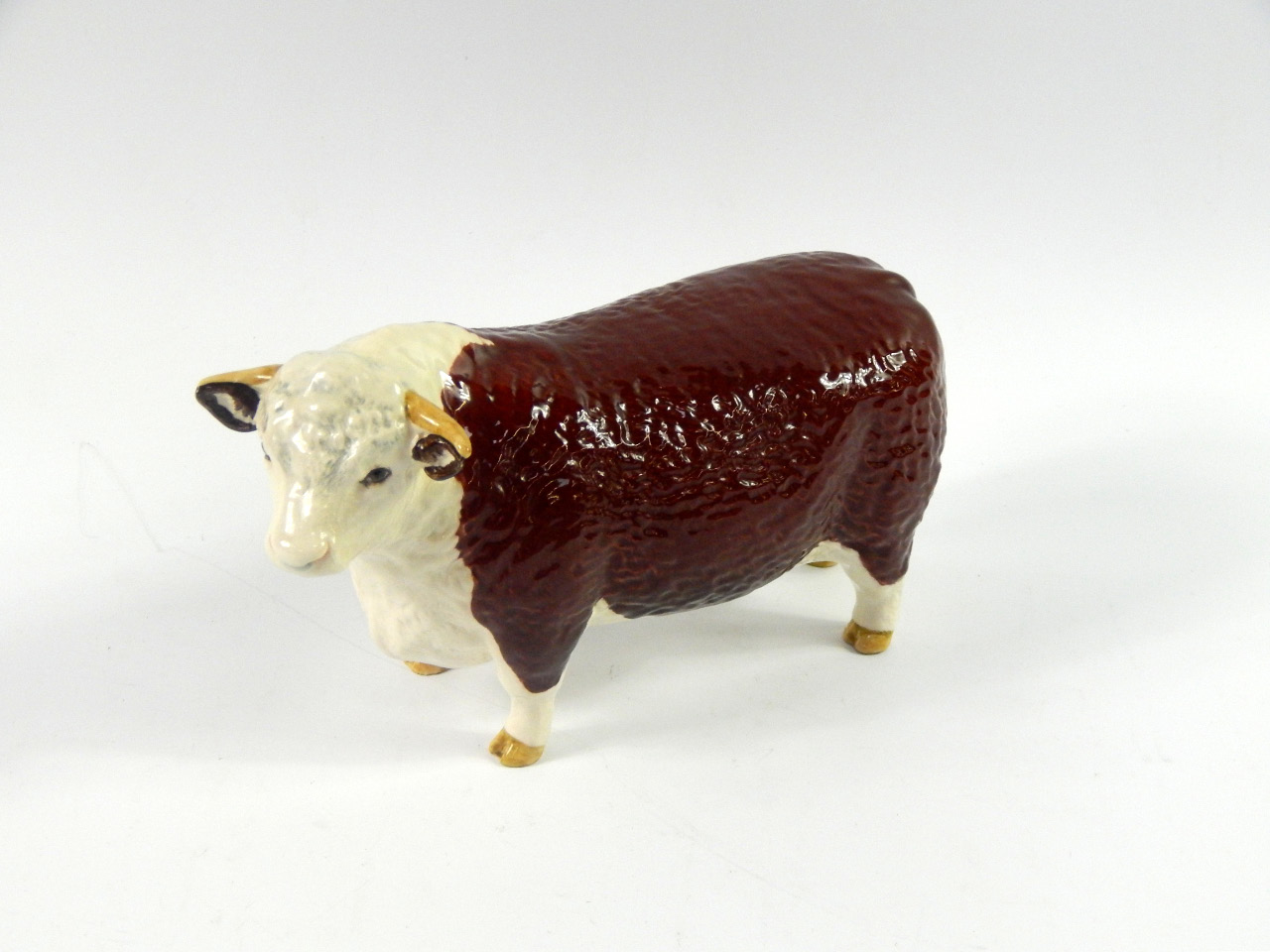 Appraisal: A Beswick figure of a Hereford Bull Ch of Champions