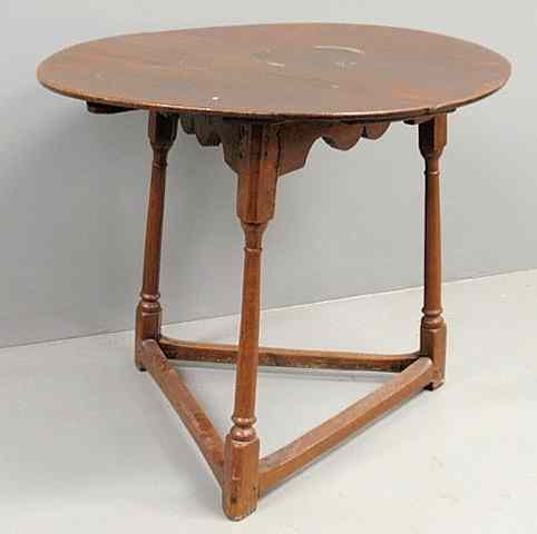 Appraisal: Yew wood tap table c with a round top above