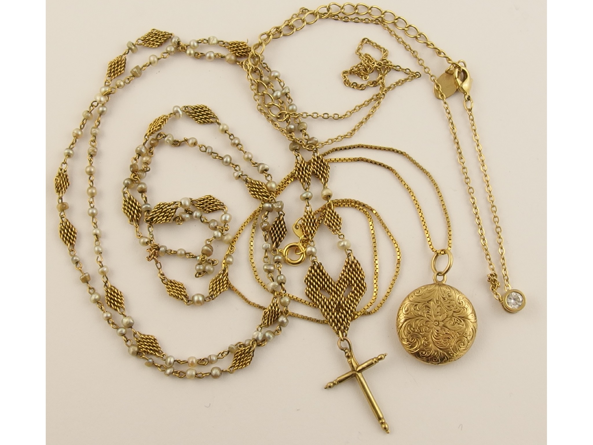 Appraisal: A yellow metal and pearl rosary with attached cross and