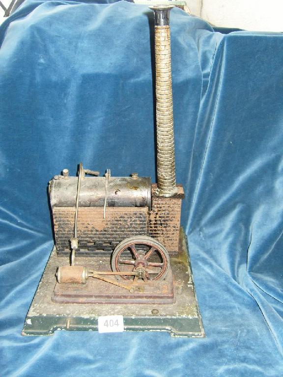 Appraisal: An early th century Bing tin plate stationary steam engine