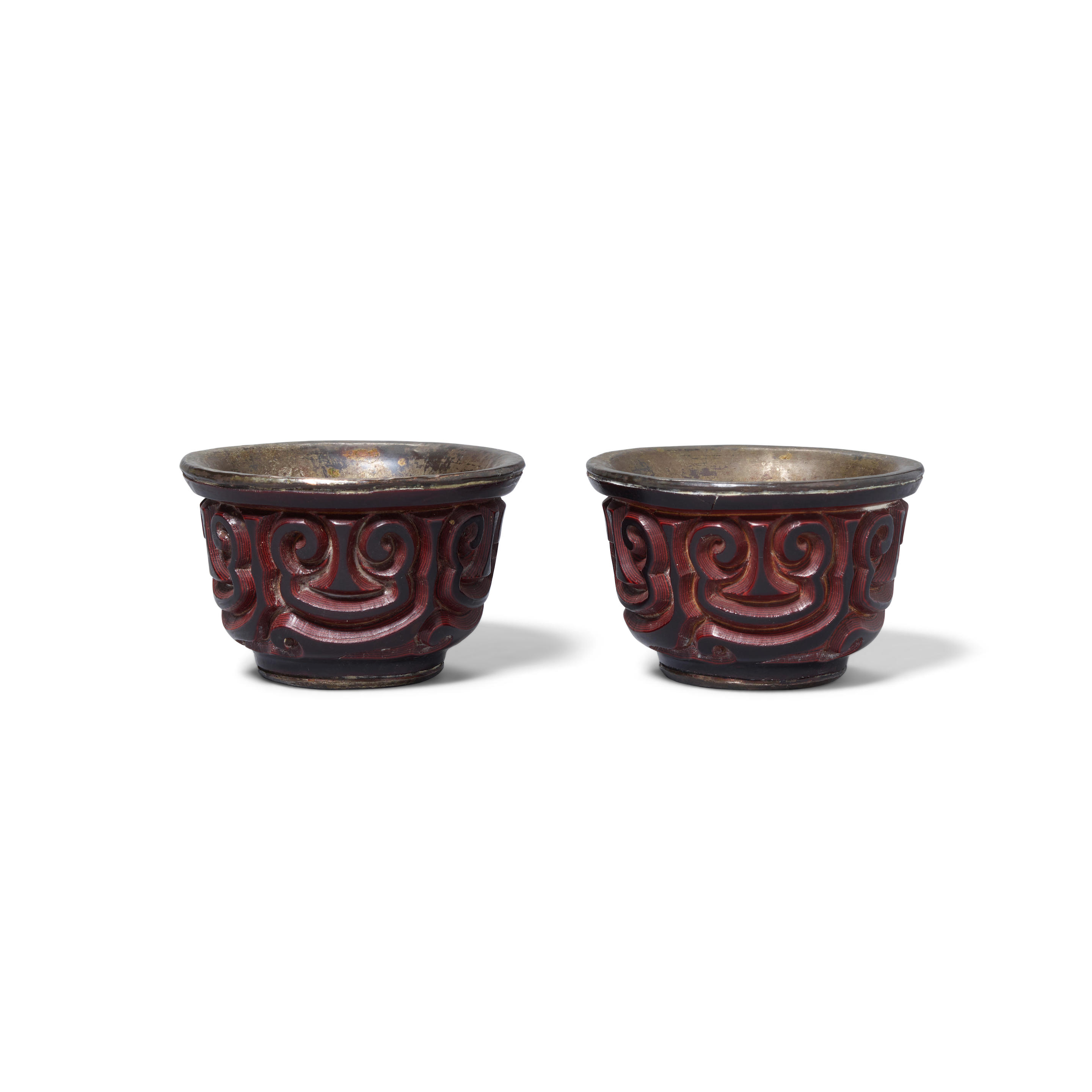 Appraisal: A PAIR OF TIXI CARVED LACQUER WINE CUPS Ming dynasty