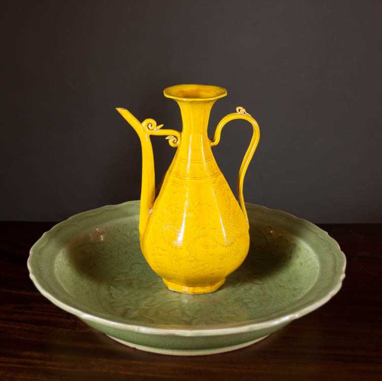 Appraisal: TWO CHINESE PORCELAINS Ming style ewer yellow glaze with incised