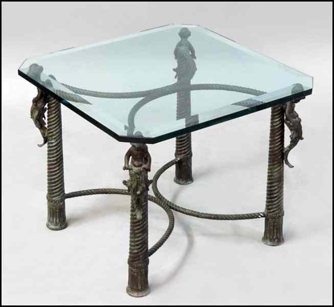 Appraisal: PATINATED METAL COCKTAIL TABLE With a glass top H ''