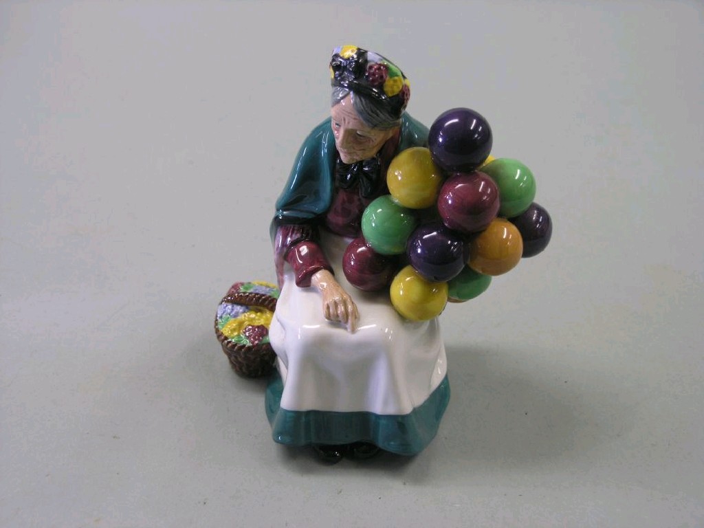 Appraisal: A Royal Doulton bone china figure 'Old Balloon Seller' HN