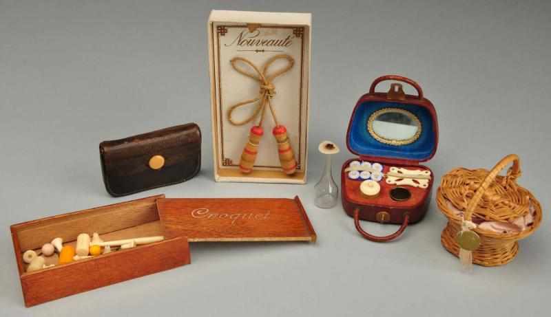 Appraisal: Lot of French Fashion and Doll Accessories Description Jump rope