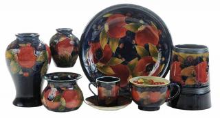 Appraisal: Seven Moorcroft Pottery Articles Burslem England decorated with pomegranates four