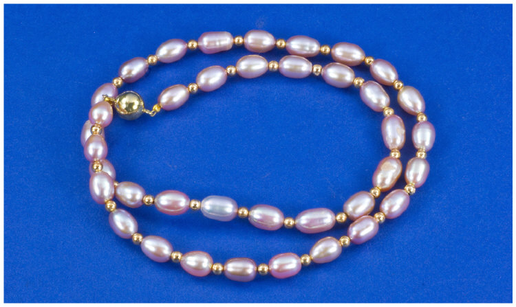 Appraisal: Strand Of Pink Pearls Between ct Gold Bead Spacers And